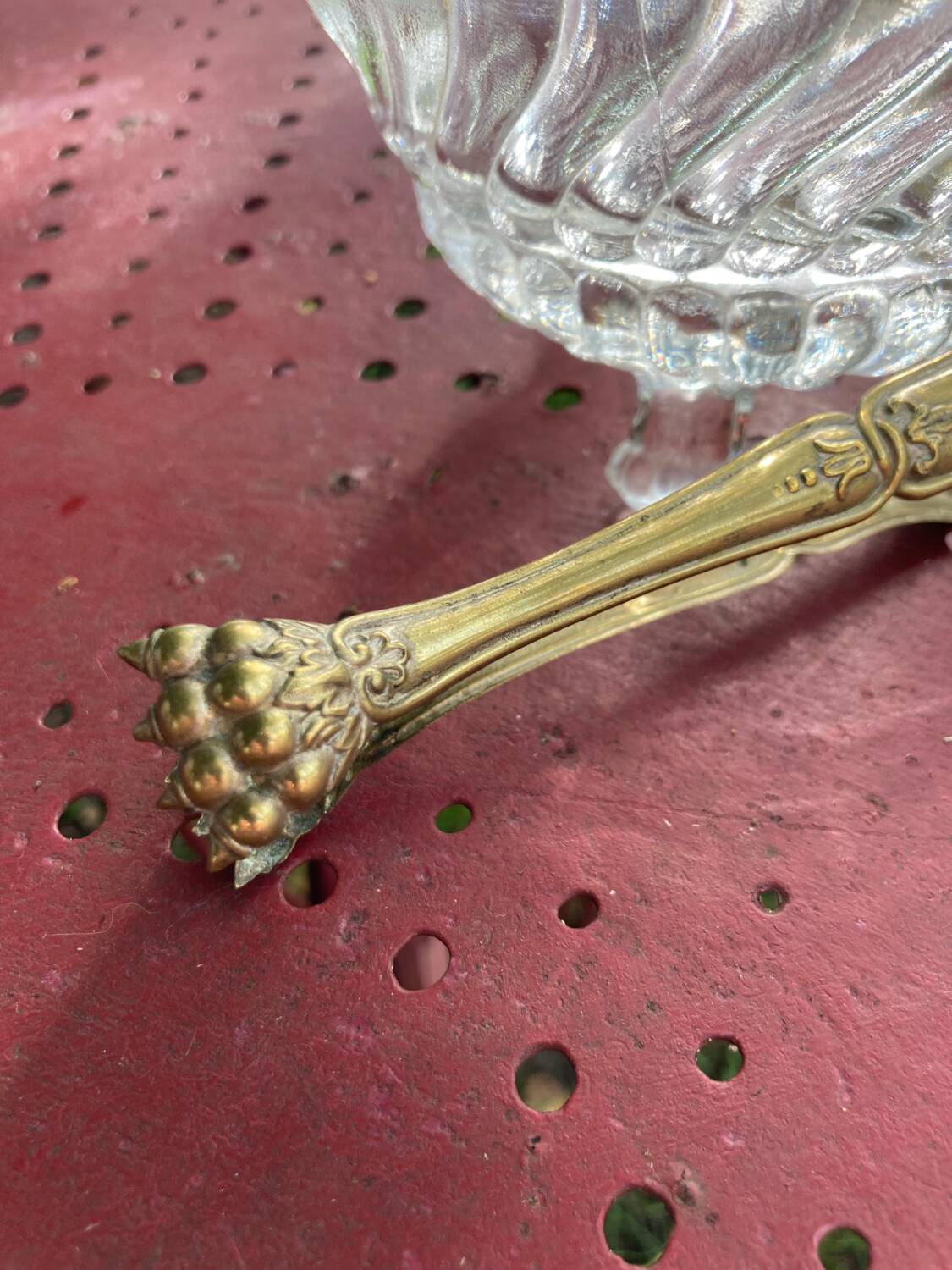 Glass sugar bowl and brass tongs