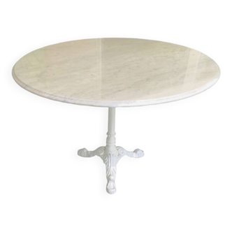 Round marble table with central cast iron leg