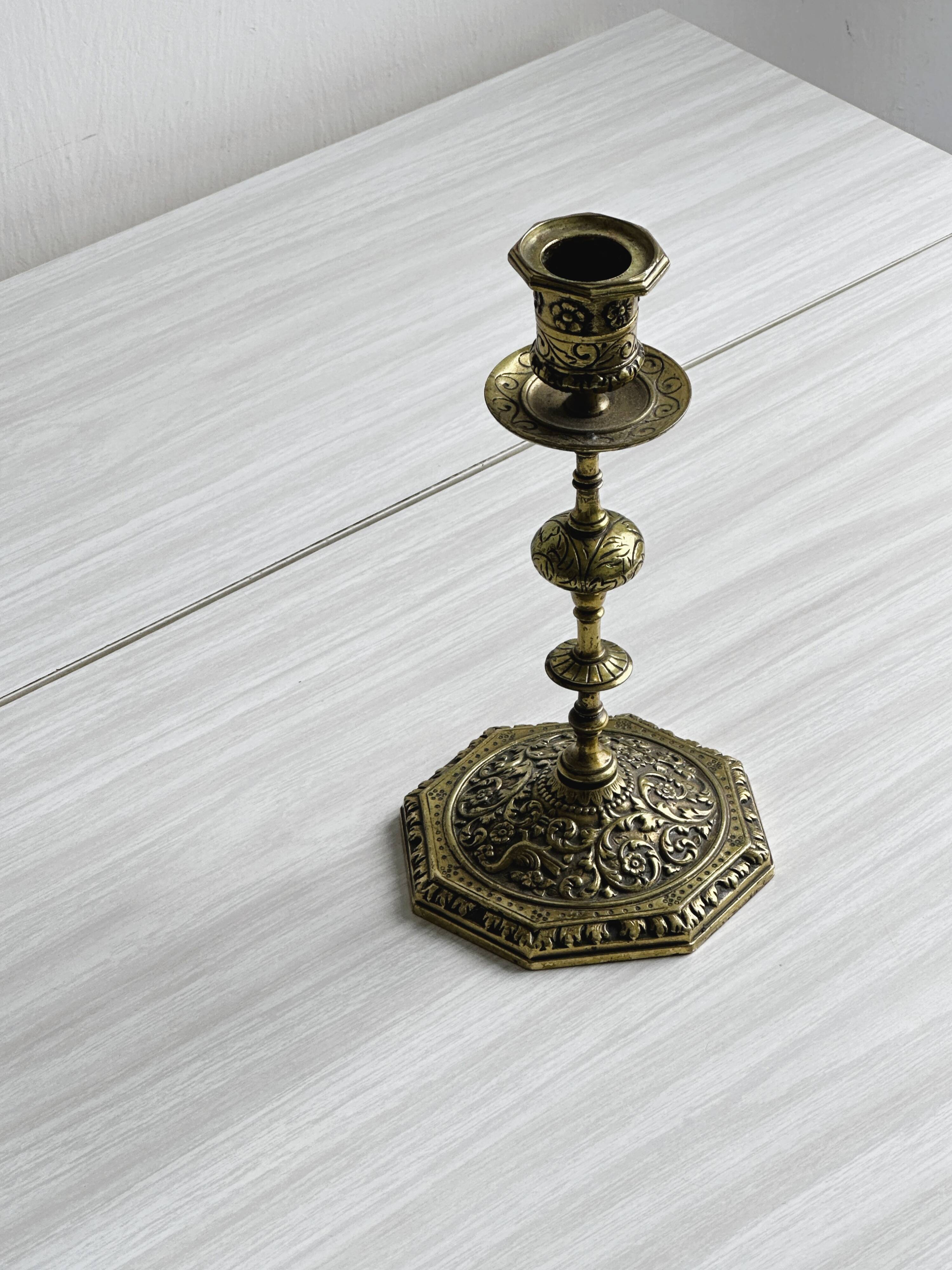 Carved brass candlestick holder