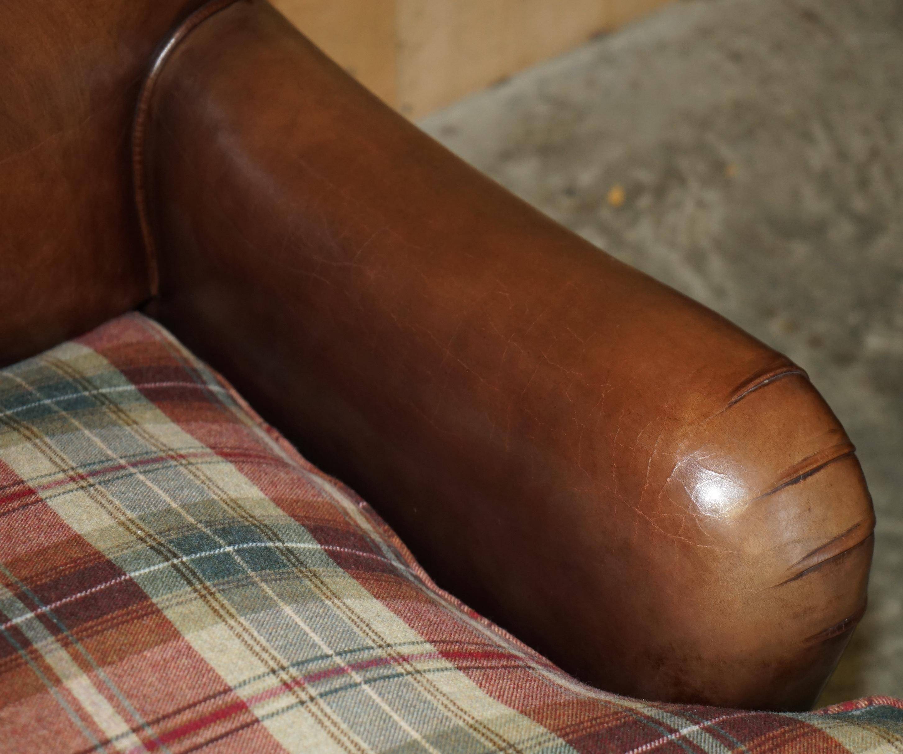 George Smith Signature Scroll leather canapé with tartan Scottish wool cushions.