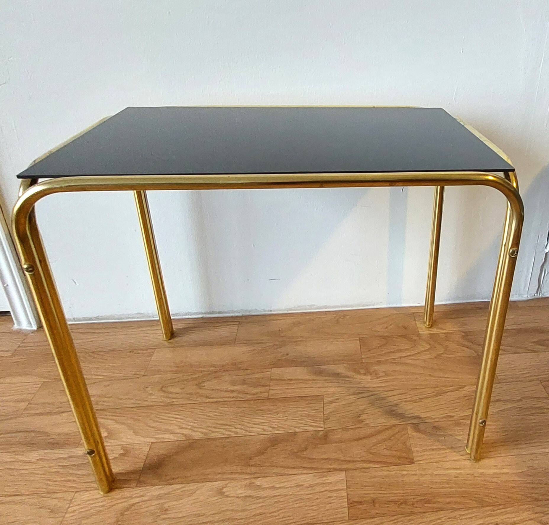 Vintage 1970 gold metal nesting tables.