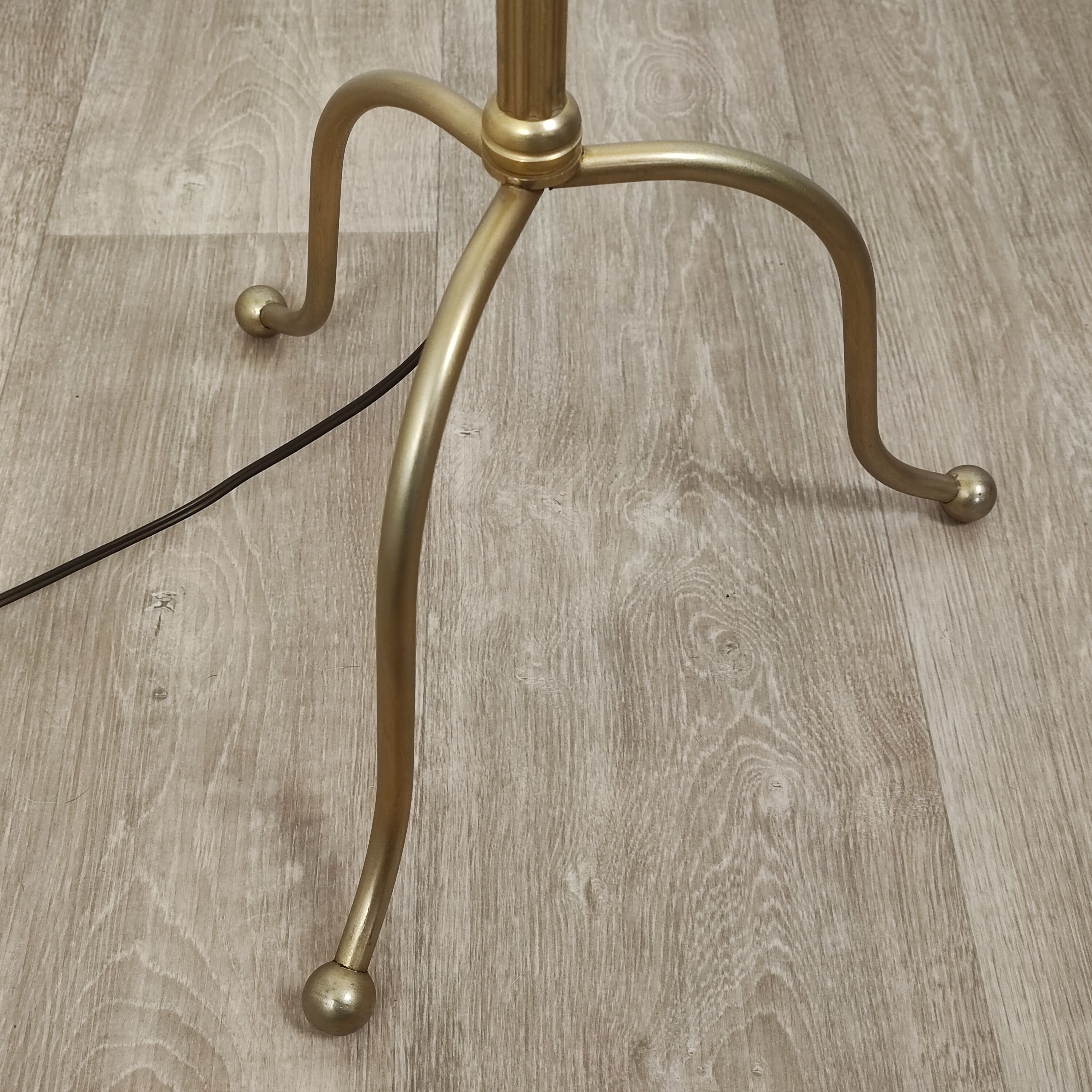 Golden tripod floor lamp