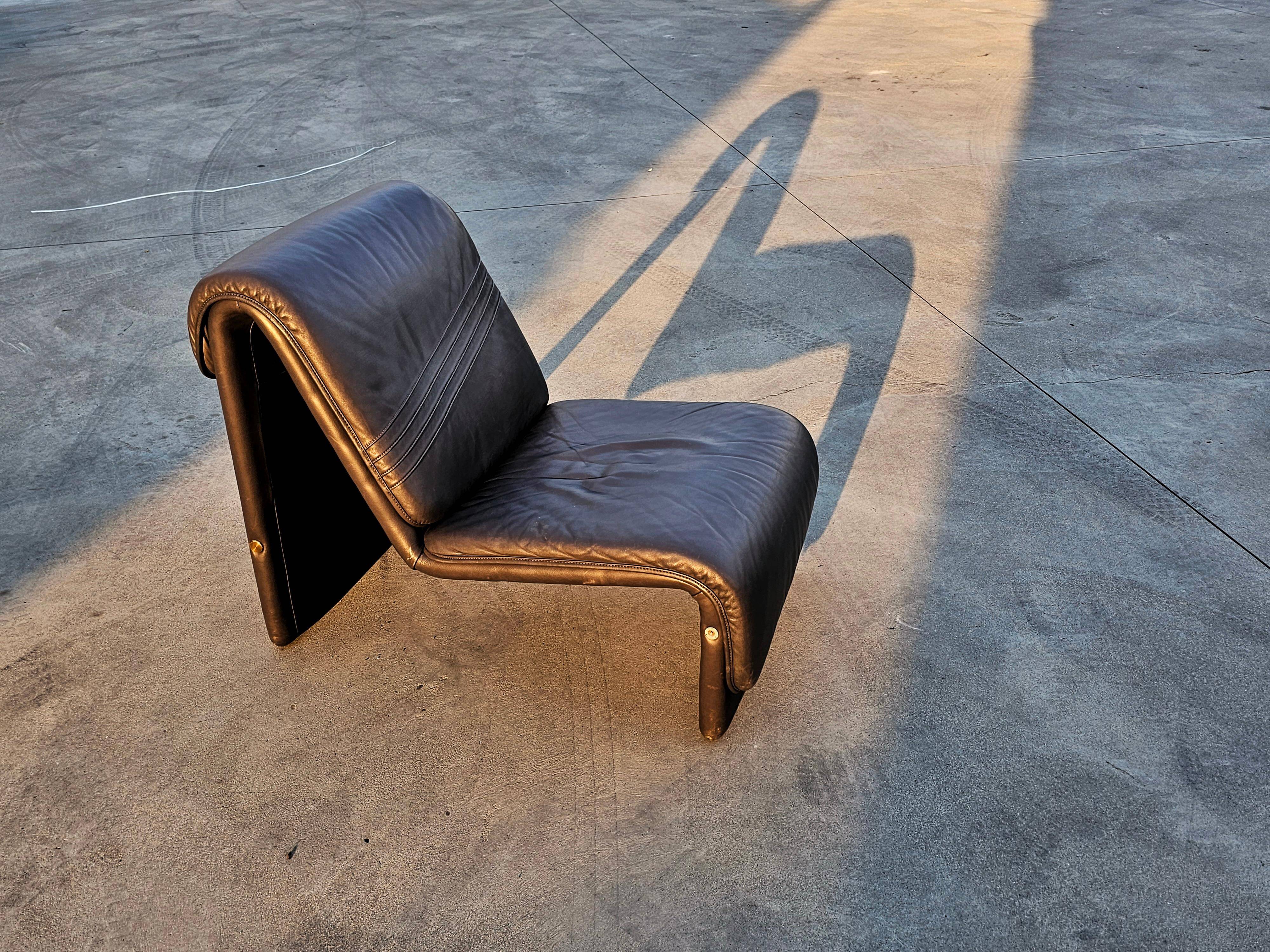 Postmodern leather lounge chairs in the style of Etienne Fermigier 1978.