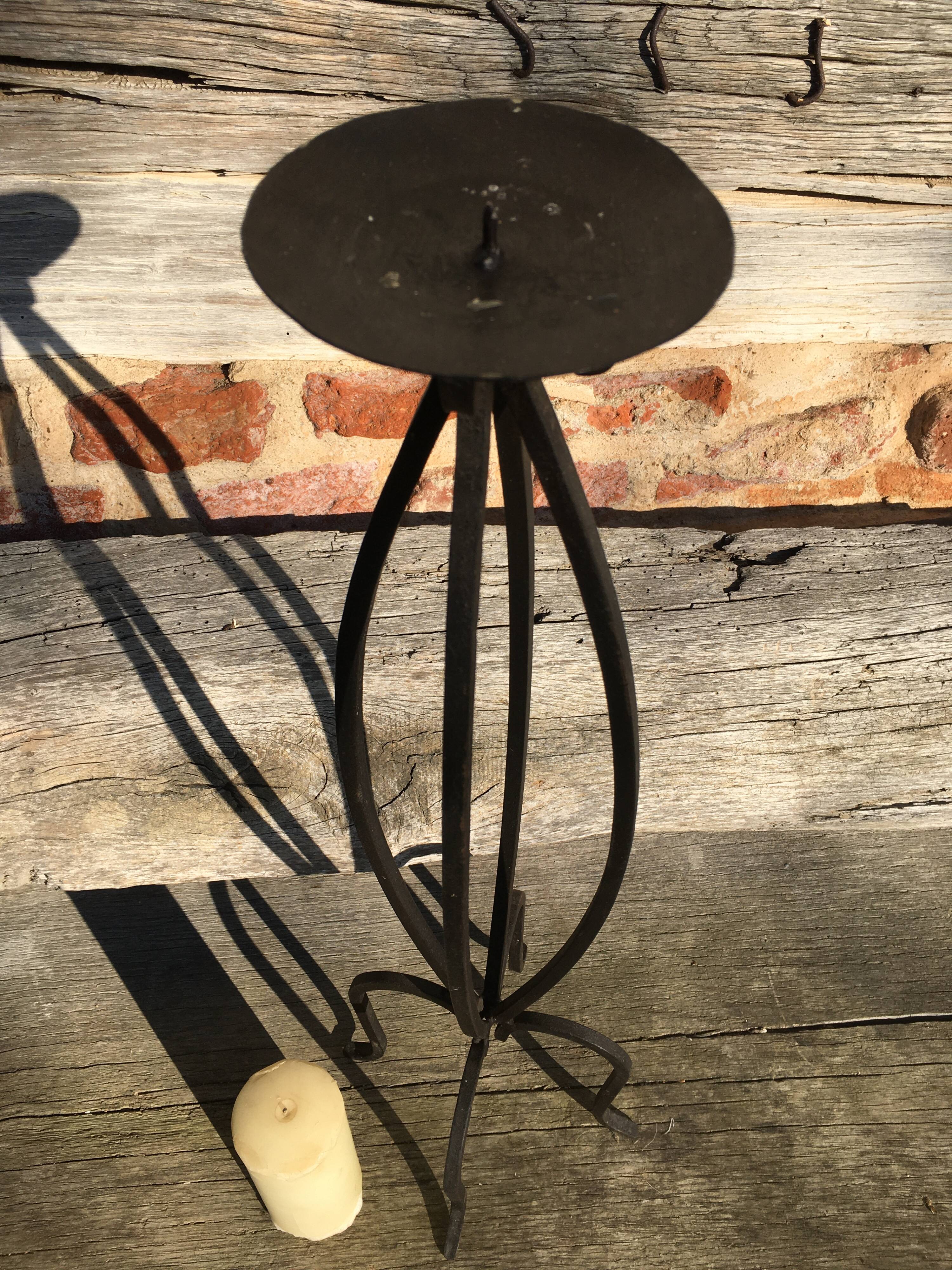 Wrought iron candlestick on feet