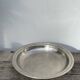 Round silver-plated metal serving dish with hallmark
