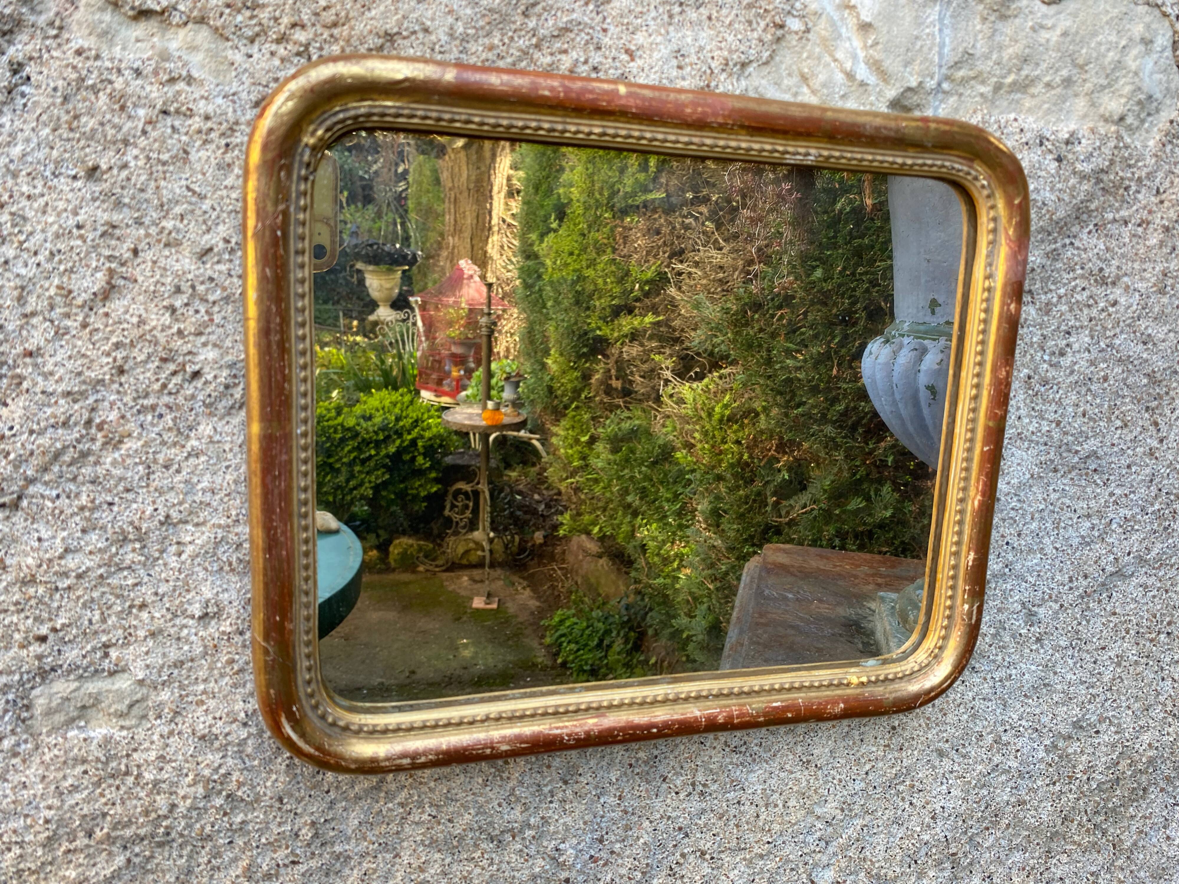 Louis-Philippe mirror gilded with gold leaf
