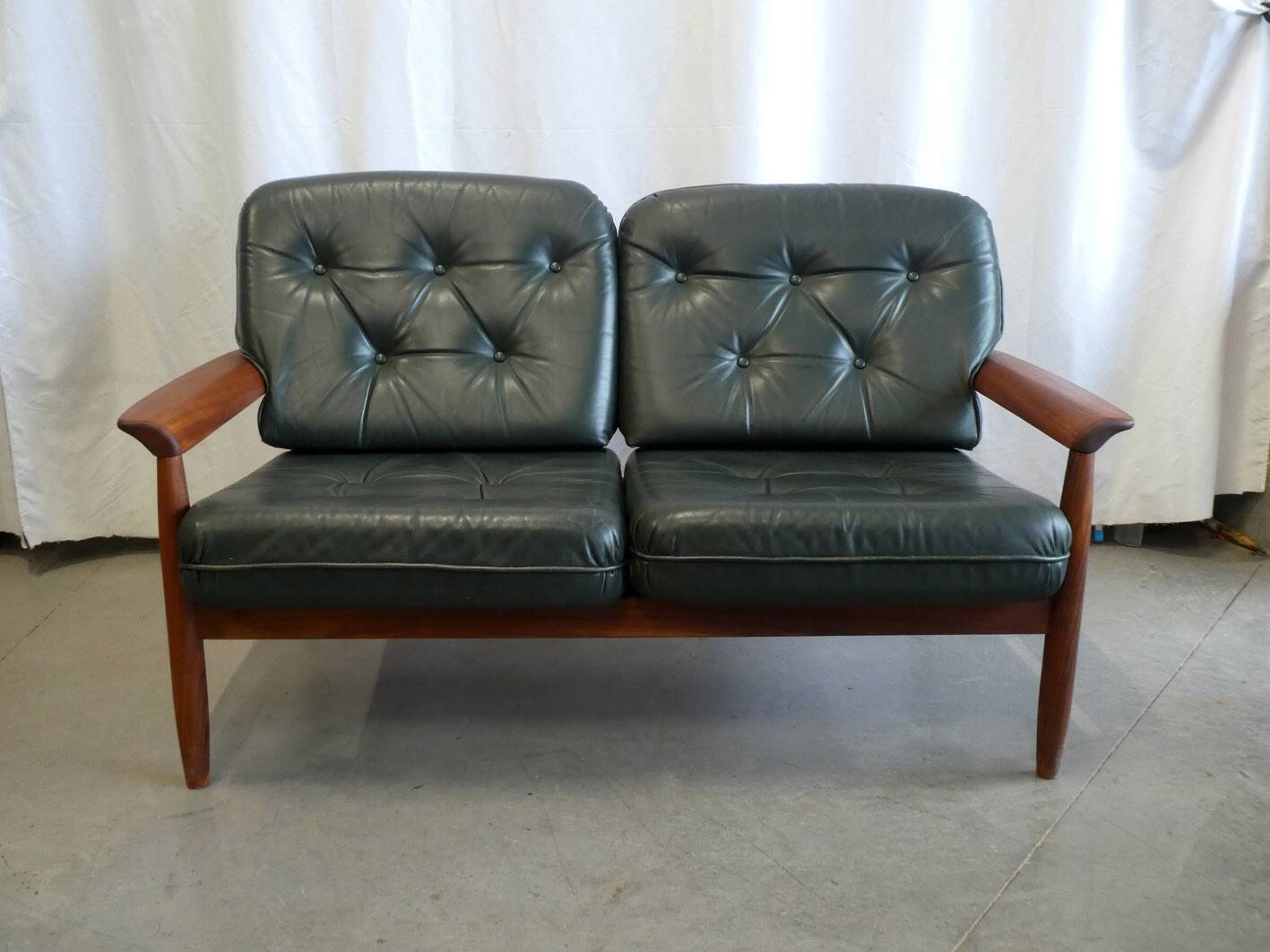 Scandinavian sofa in teak and green leather