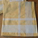 4 old yellow towels