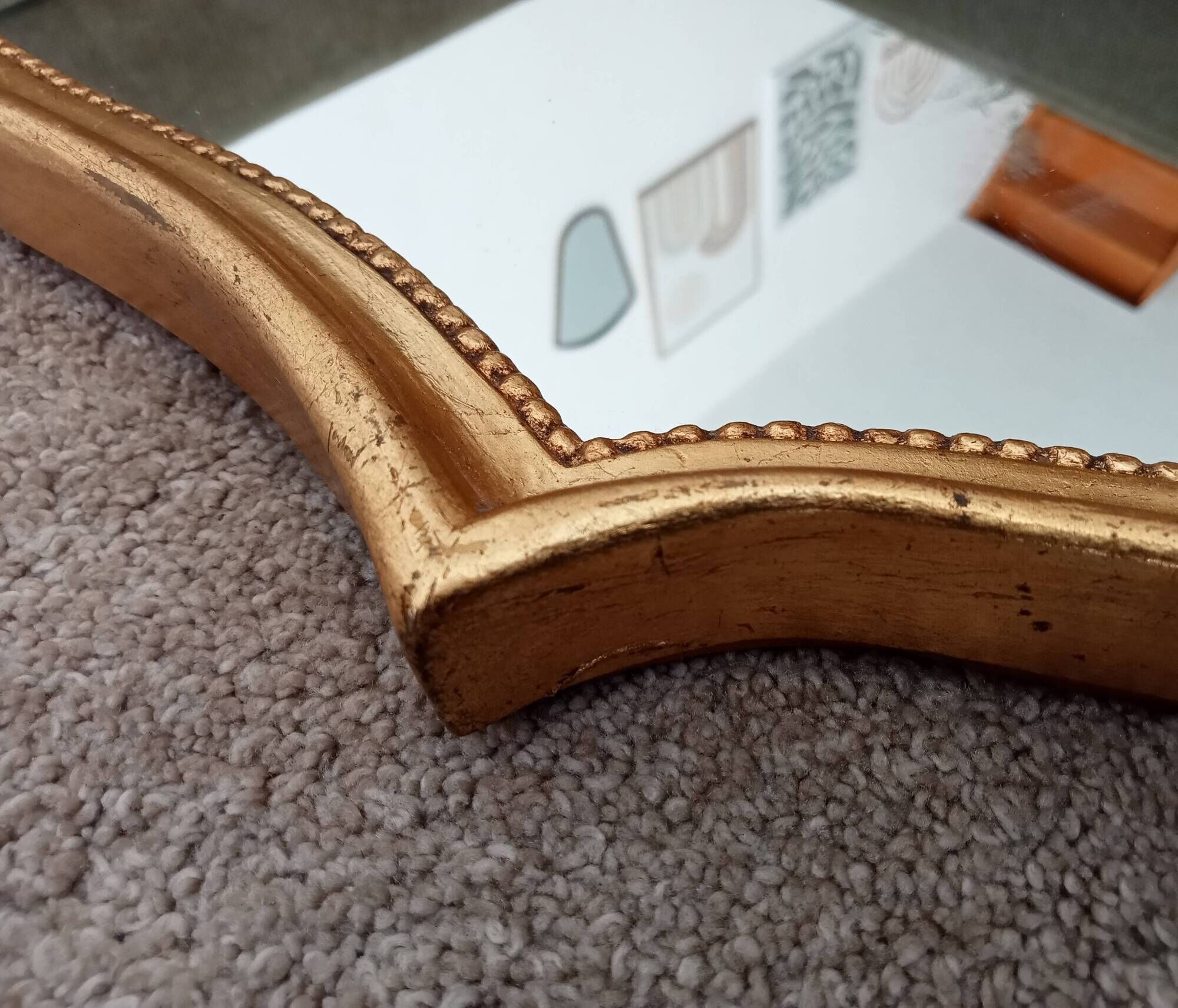 Vintage baroque mirror in gilded wood in the Louis XV style.