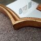 Vintage baroque mirror in gilded wood in the Louis XV style.