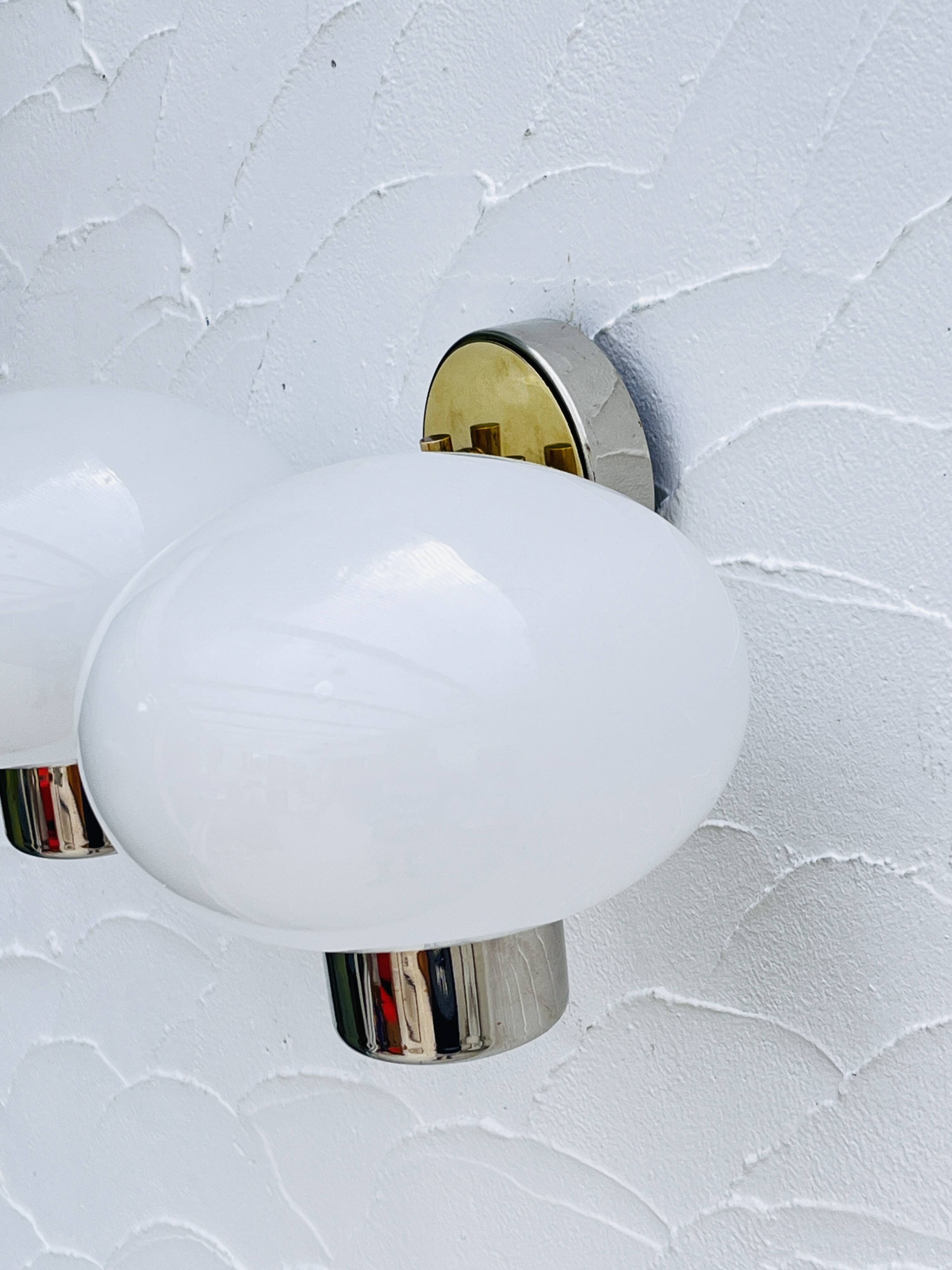 Double opaline brass wall light