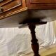 Vintage octagonal gueridon, 4 drawers, leather top, lion's paw feet.