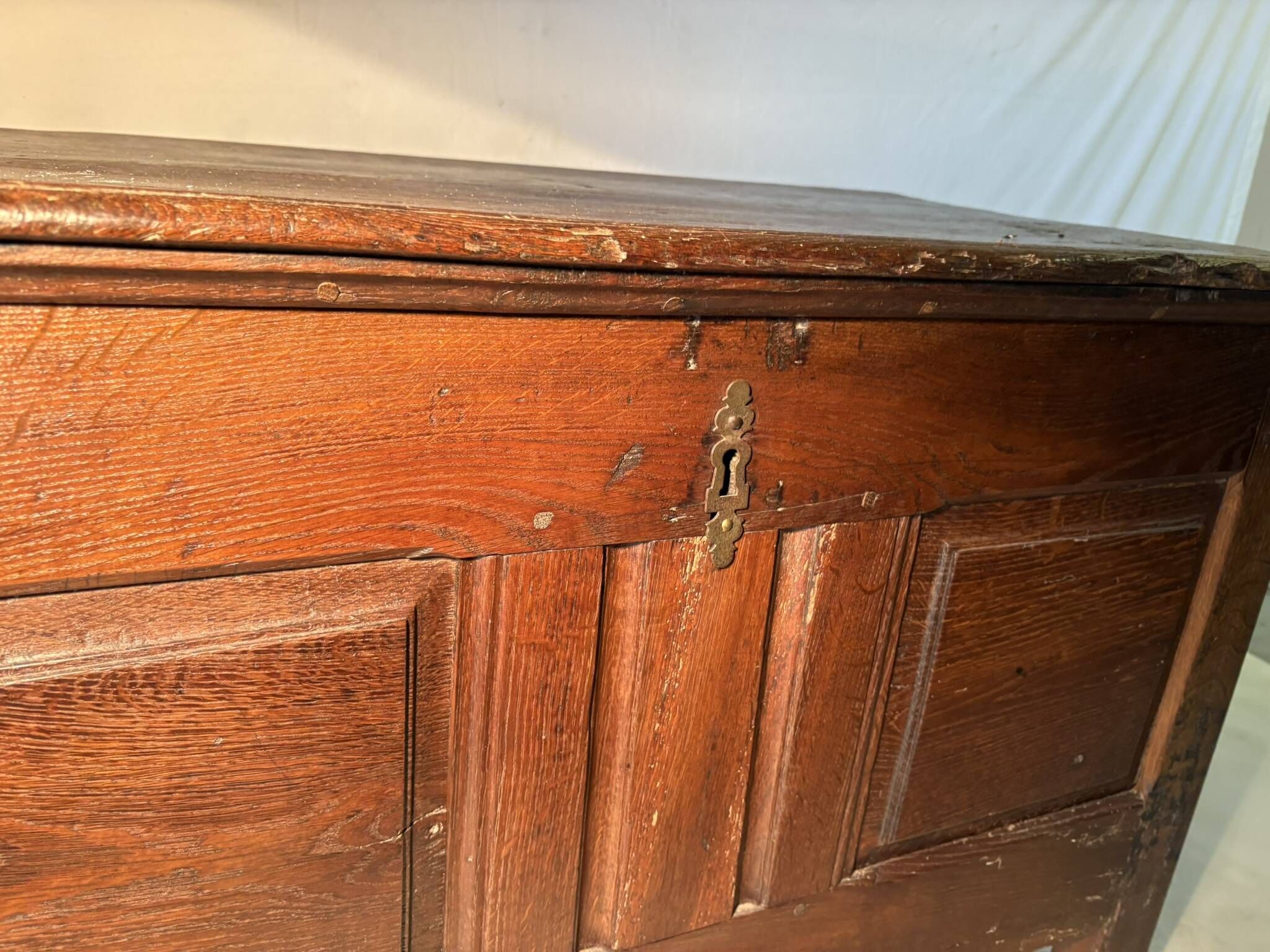 Rustic antique oak chest, original fittings and moulded panels.