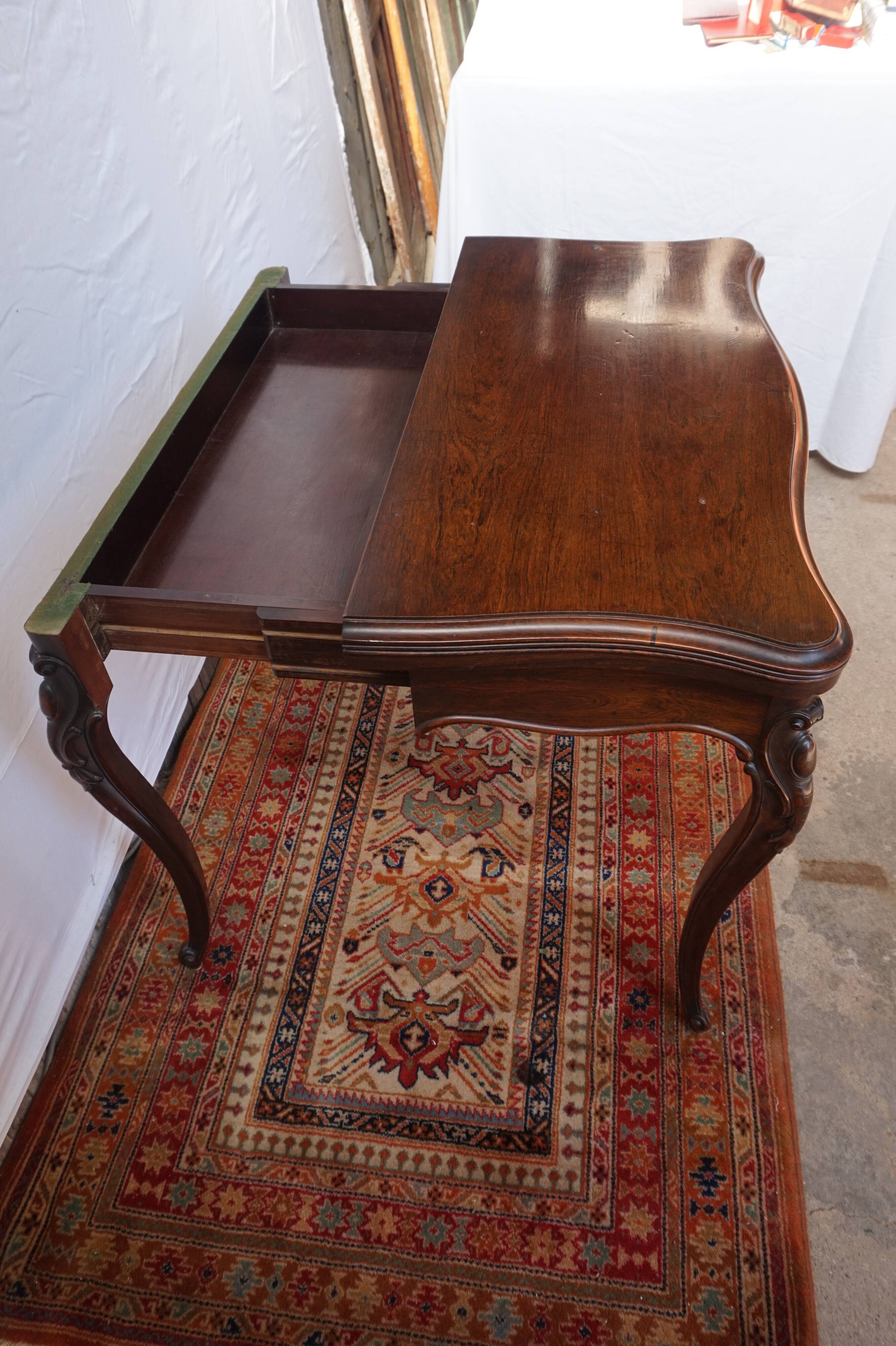 A XIX rosewood games table