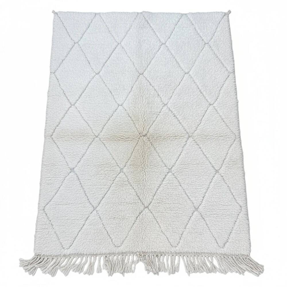 Small Moroccan rug with small white diamonds.