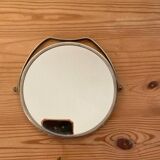 Miroir rond vintage en métal argenté.