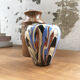 Vase dripping in varnished earth