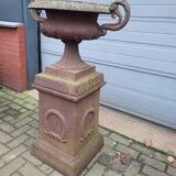 Cast iron garden urn on pedestal with handles