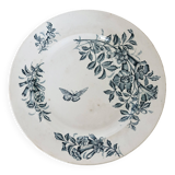 Plat de service rond terre de fer Badonviller modèle Jasmin motif fleuri papillon fin XIXème