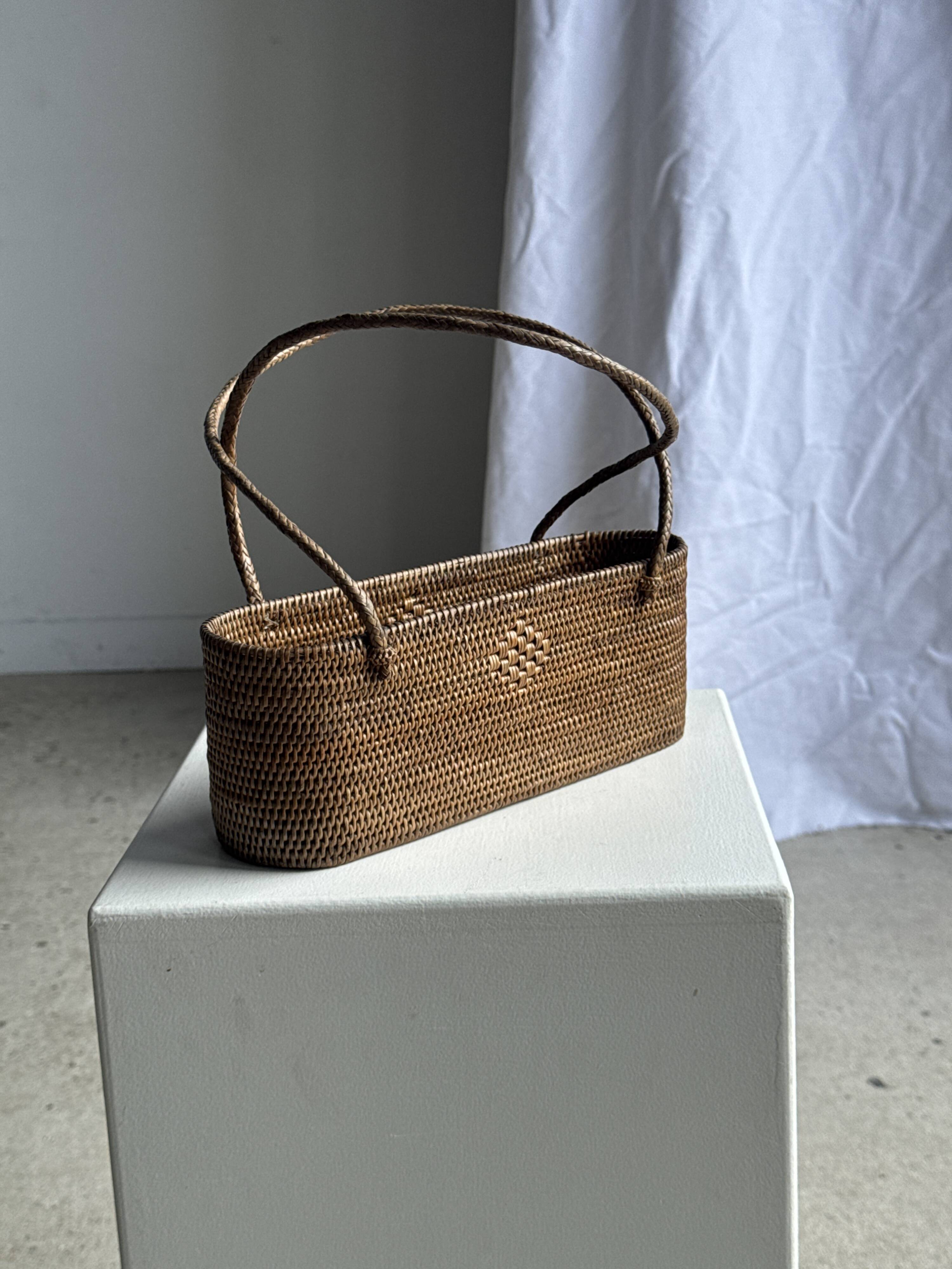 Small oval basket with long handles, traditional Indonesian L28xH10