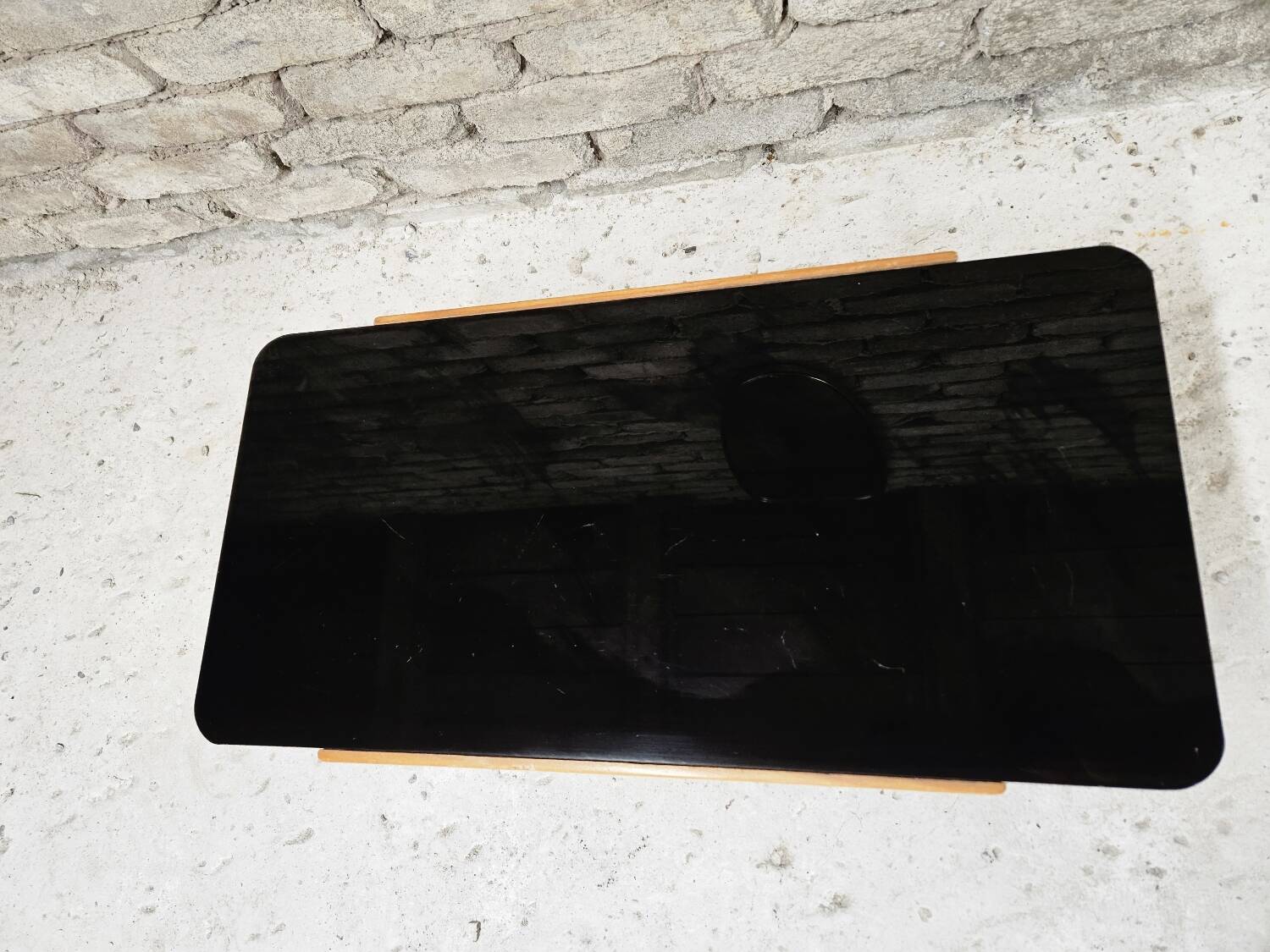 Small opaque black glass coffee table 1960