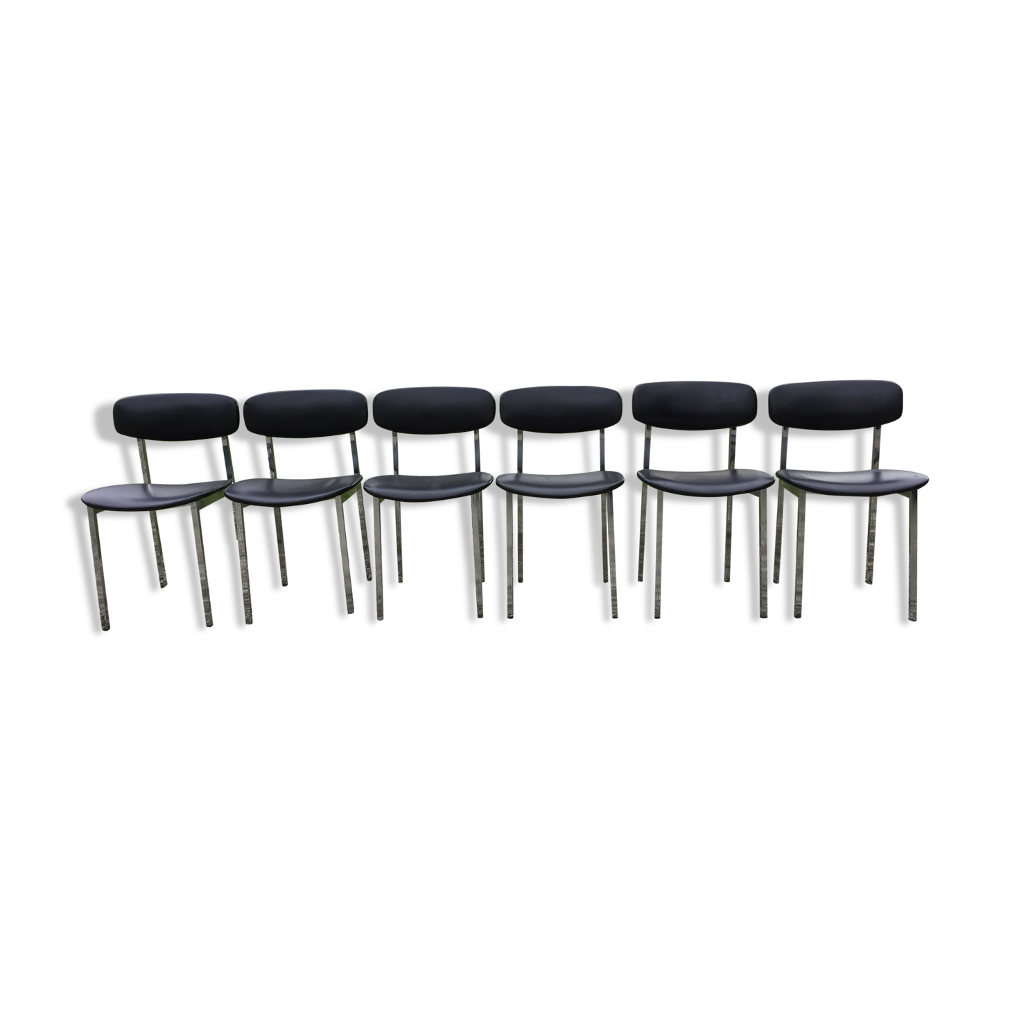6 vintage chairs in black skaï with chrome metal tubular base.