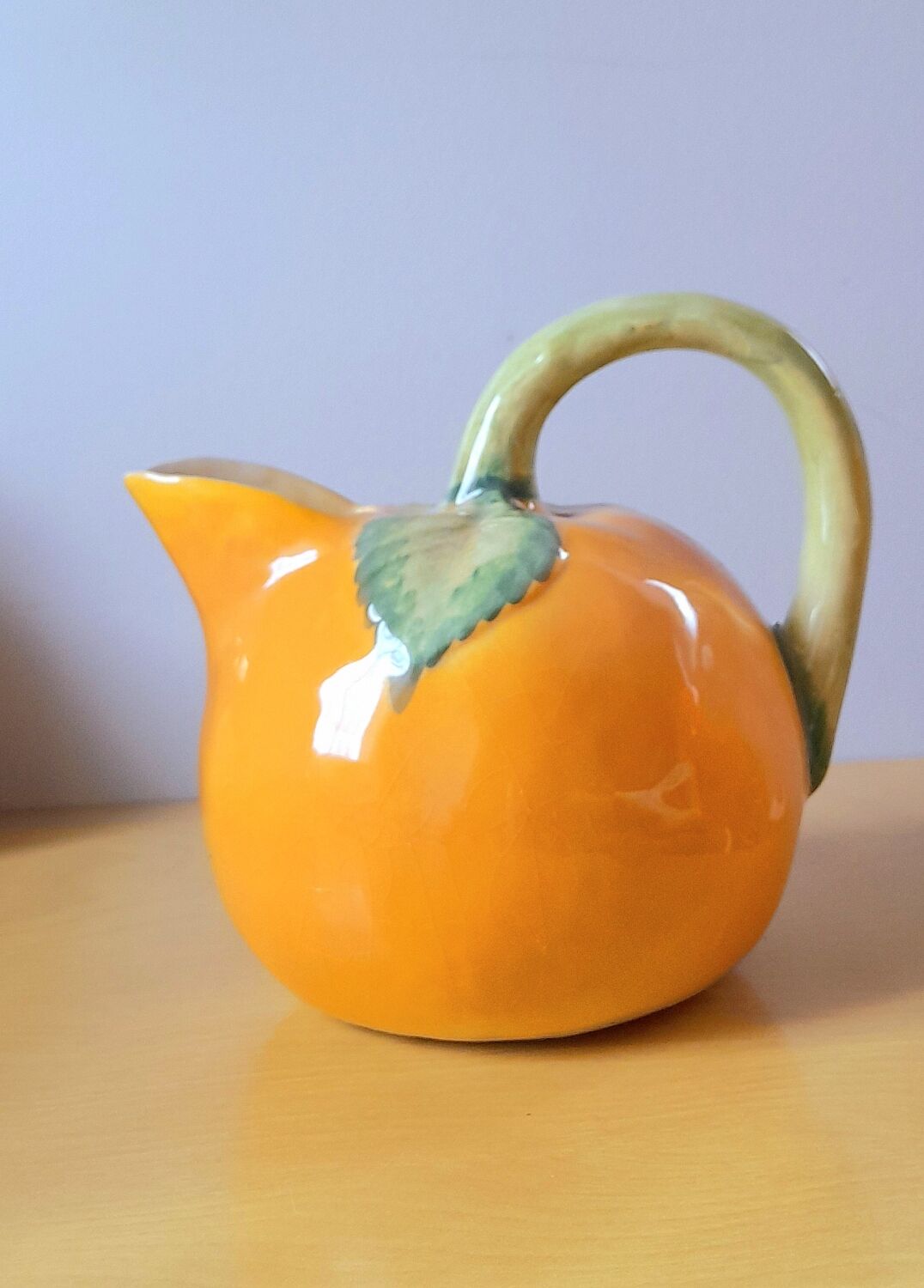 Orange pitcher in slip