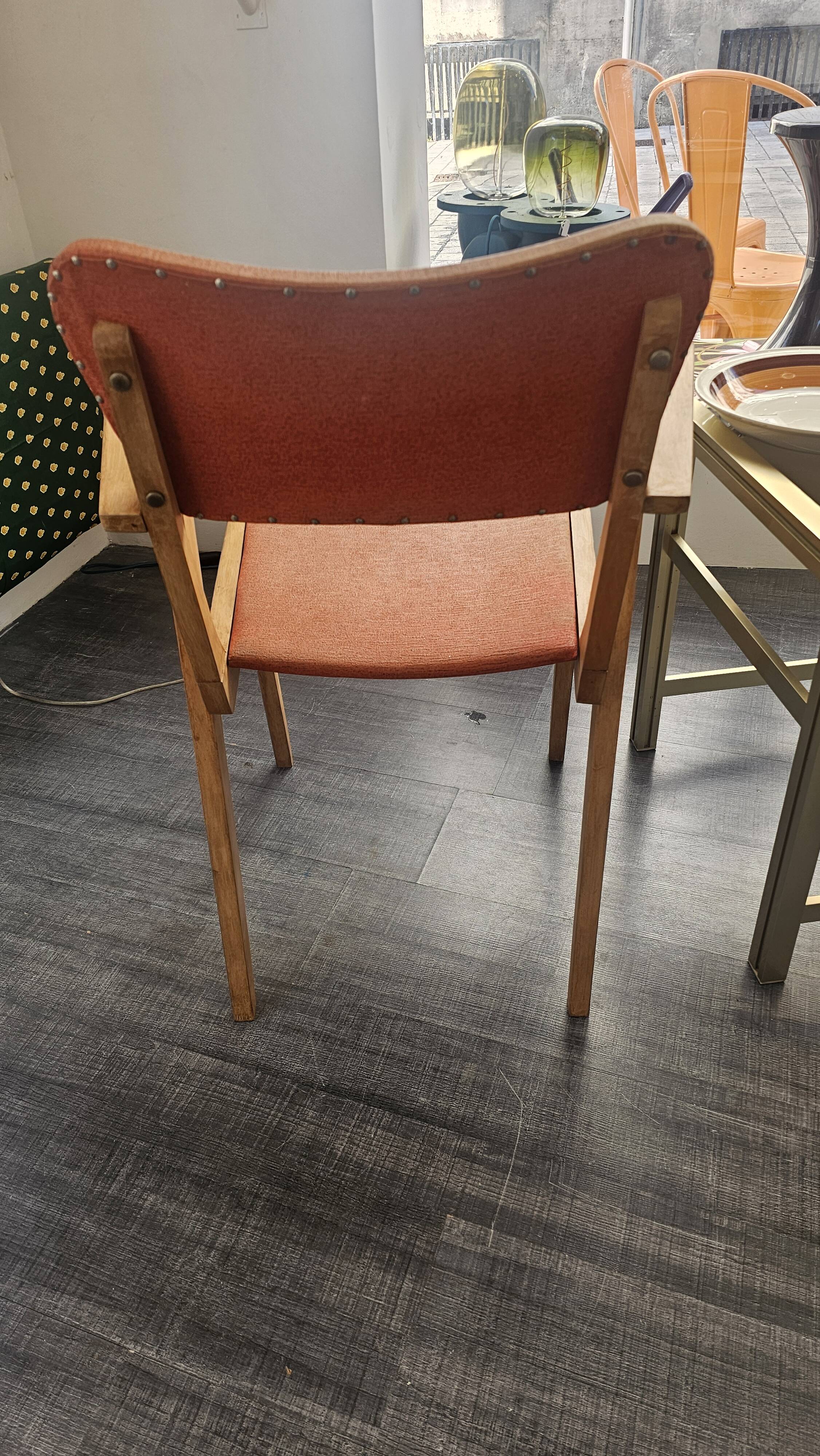 Modernist armchair in wood and orange fabric