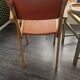Modernist armchair in wood and orange fabric