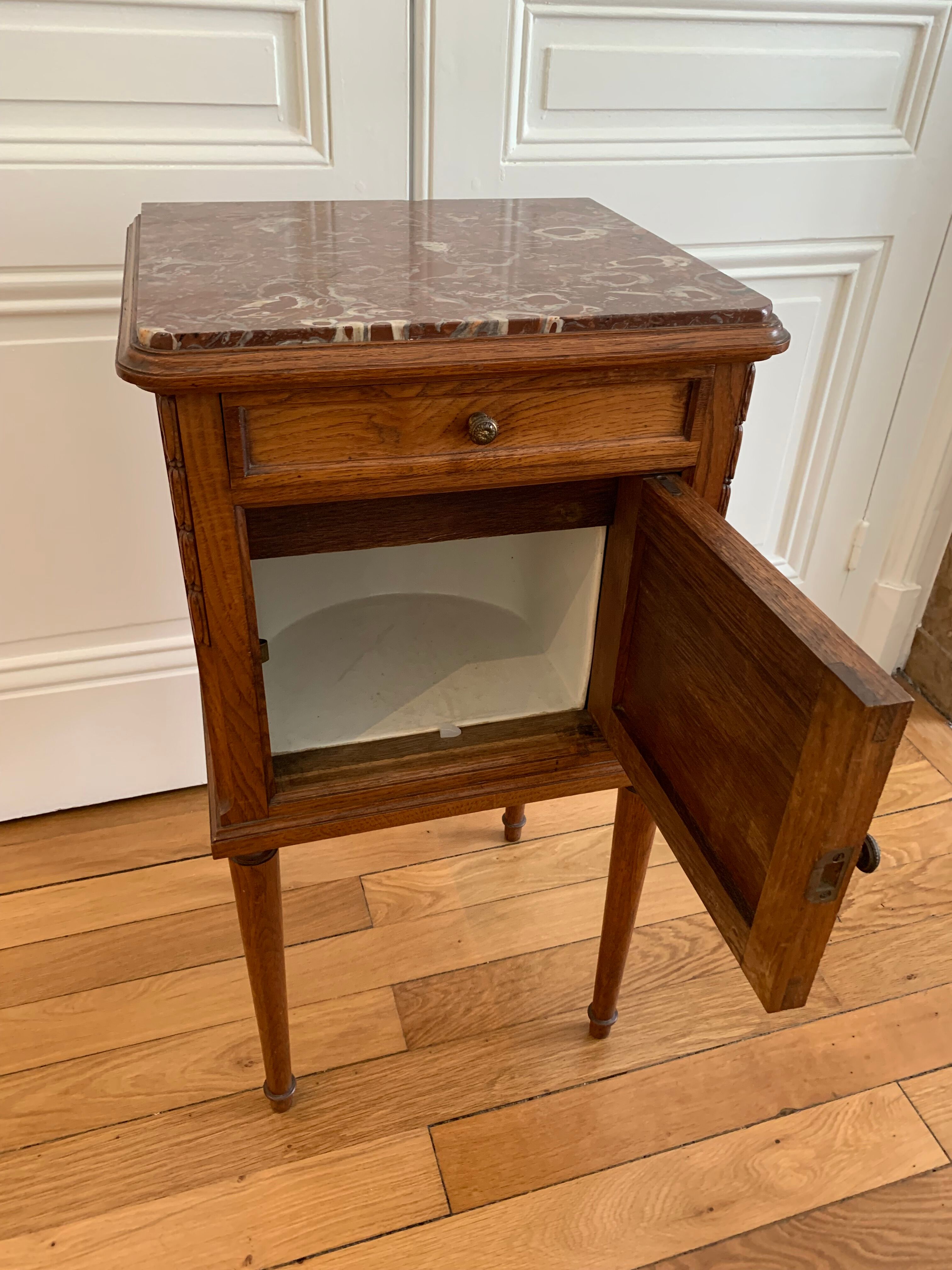 Pair of high marble and walnut bedside tables