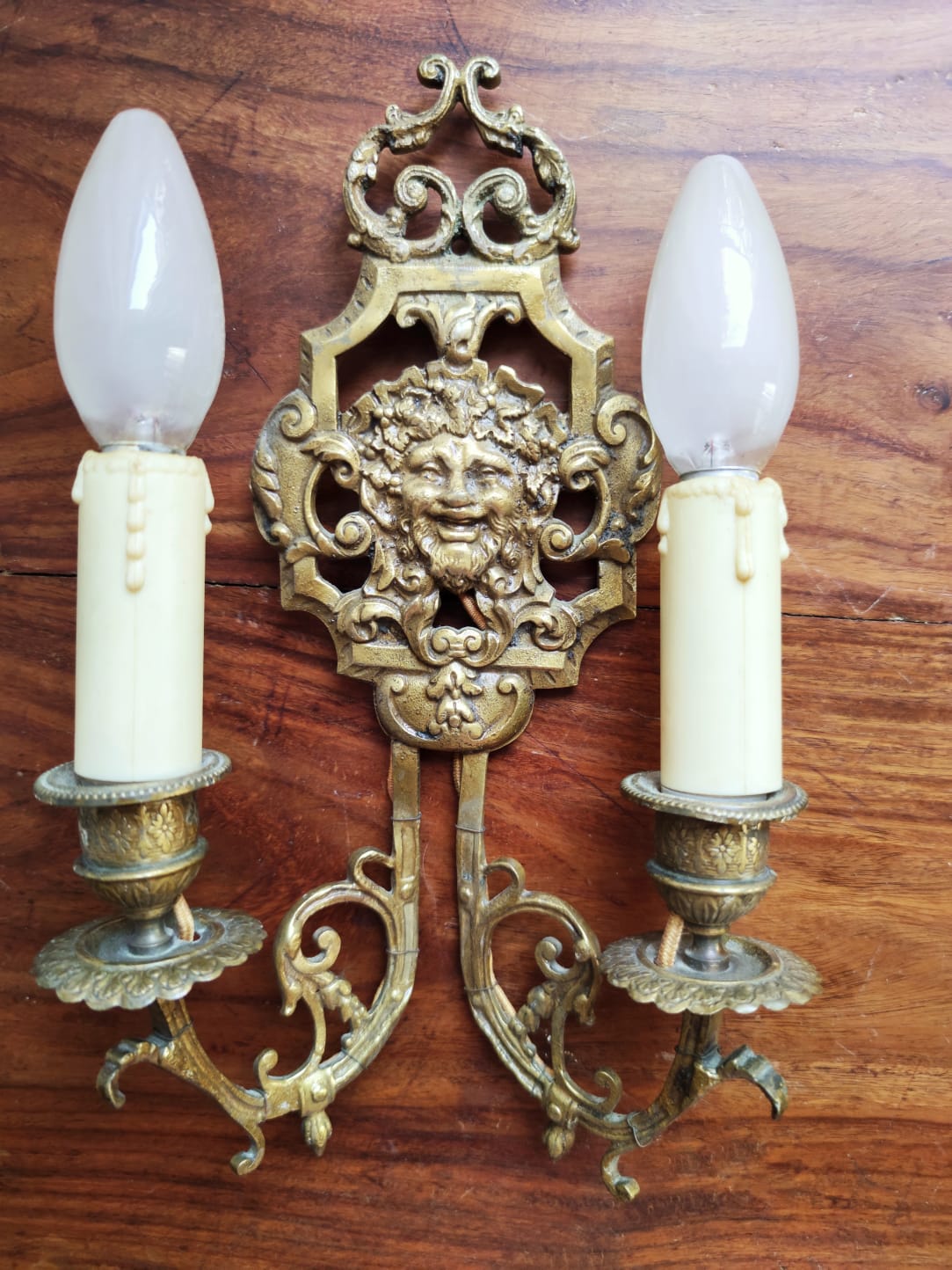 Pair of gilded bronze sconces decorated with Louis XIV style mascarons