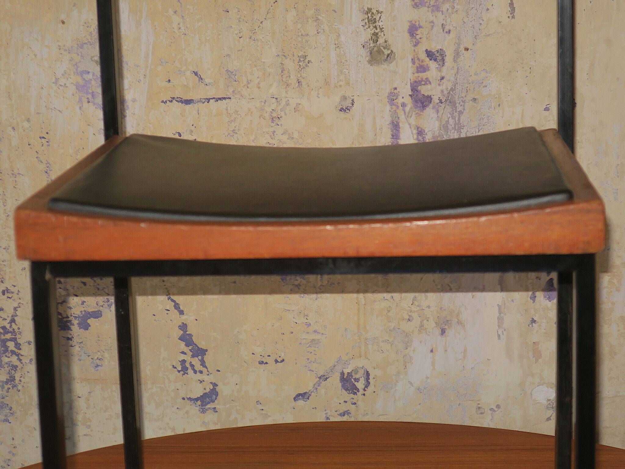 Pair of teak and iron stacking chairs, 1960s