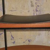 Pair of teak and iron stacking chairs, 1960s