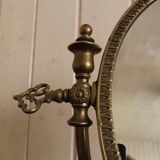 Oval mirror on psyche stand