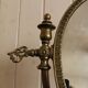 Oval mirror on psyche stand