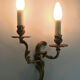 Former pair of double-light wall light in bronze or brass. Year 50 60