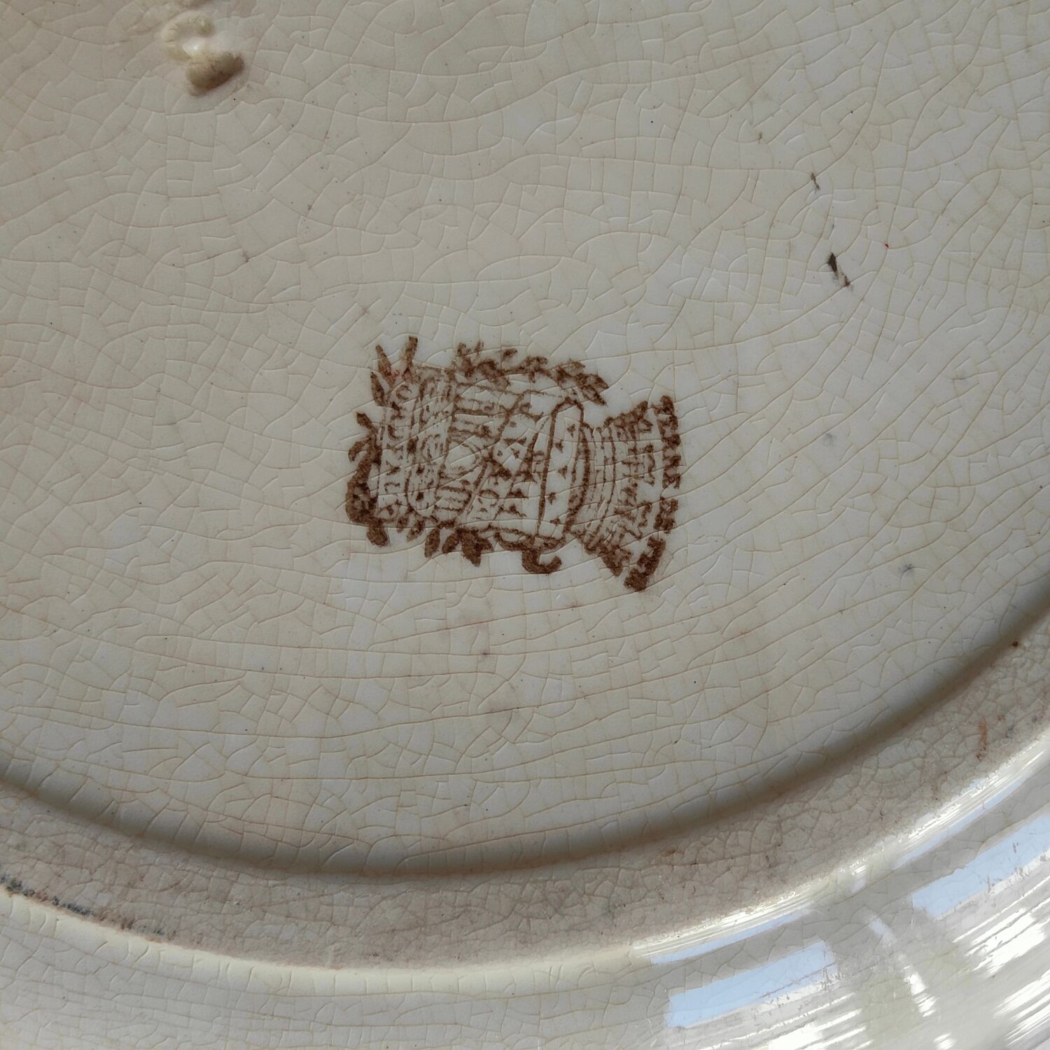 Round plate in iron earth Jules Vieillard