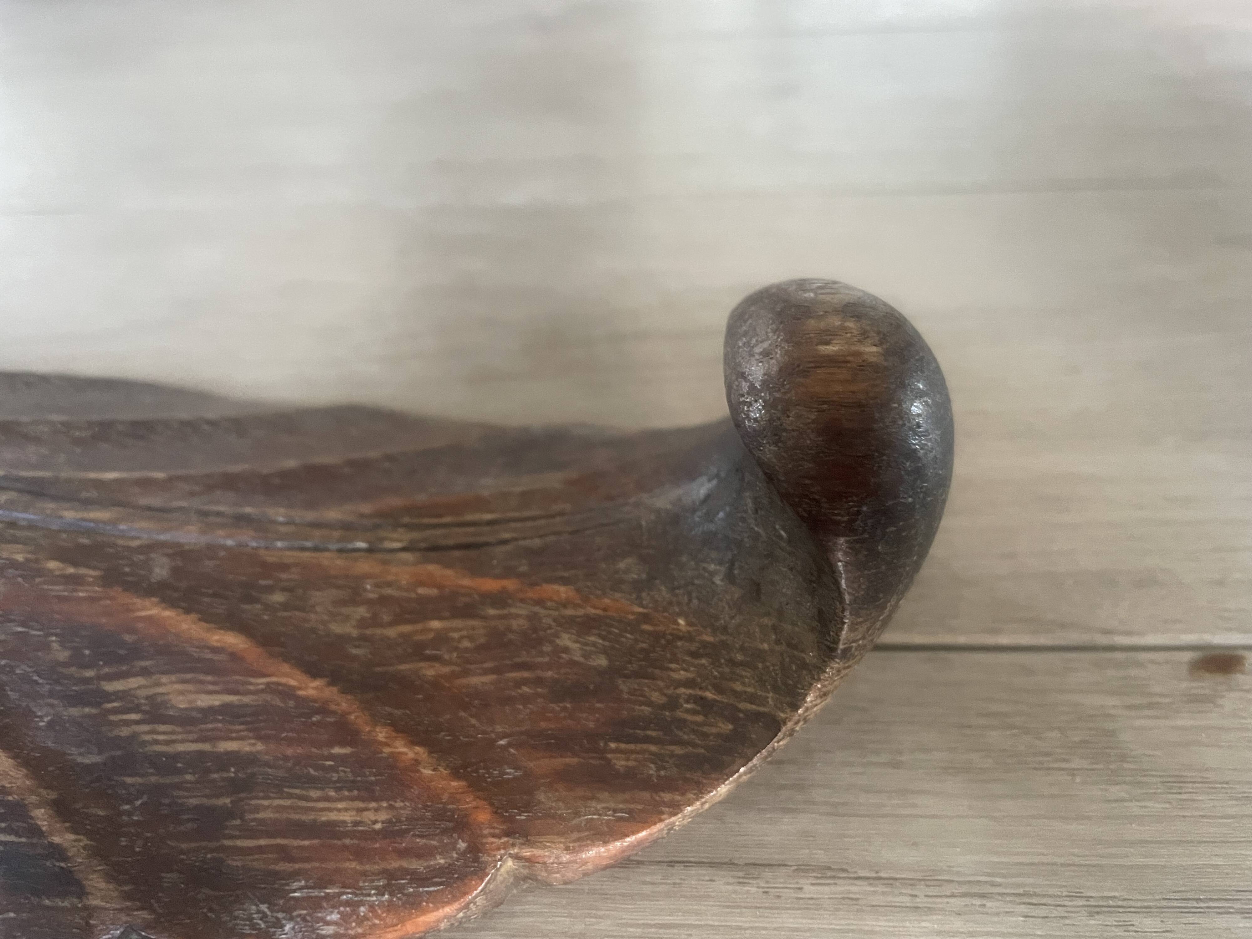 four decorative carved wooden objects