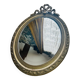 Large antique oval mirror