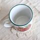 Vintage white ceramic mug with red apple pattern