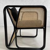 Cubic armchair in black rattan and canework