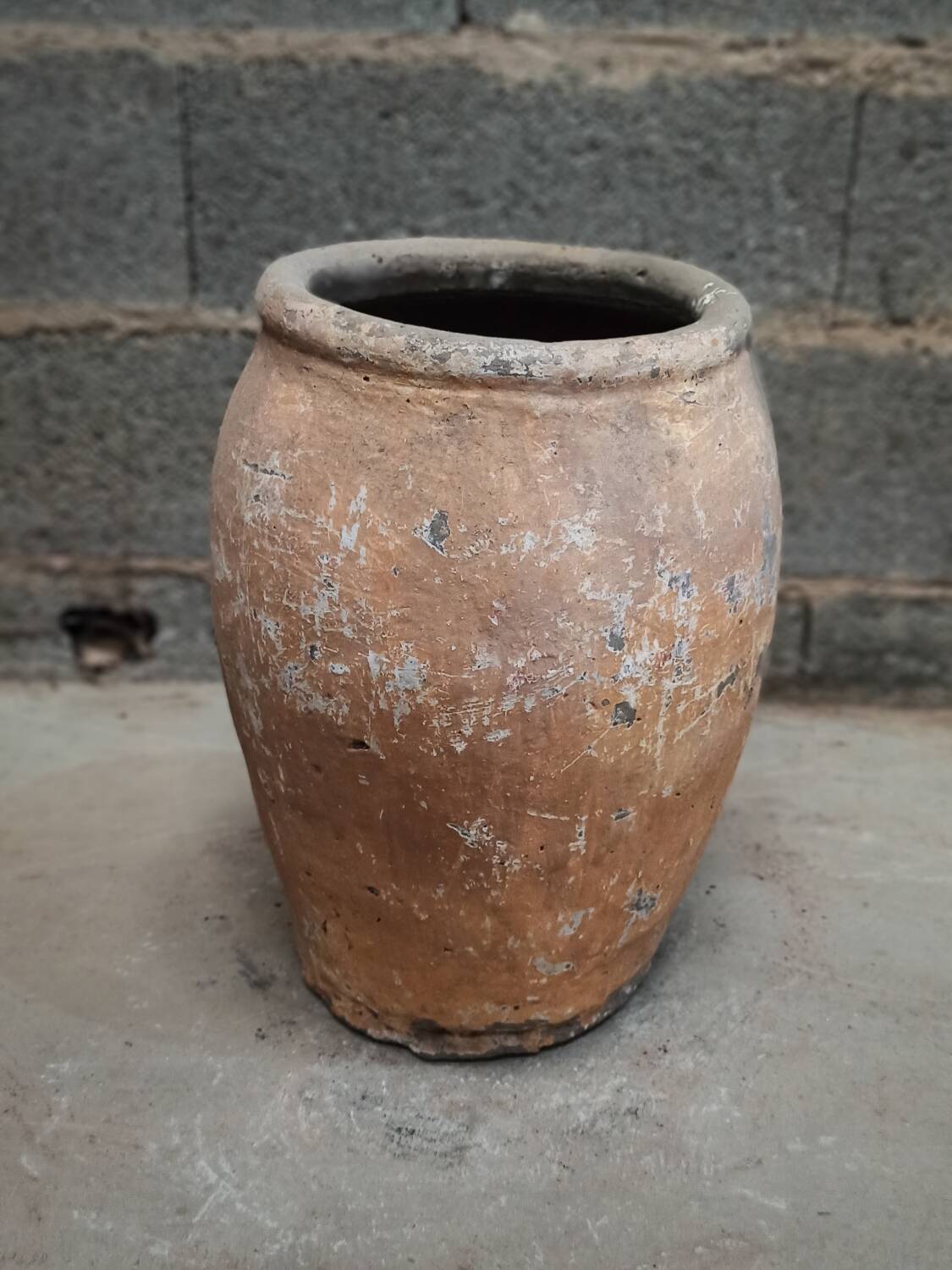 Old orange terracotta pot