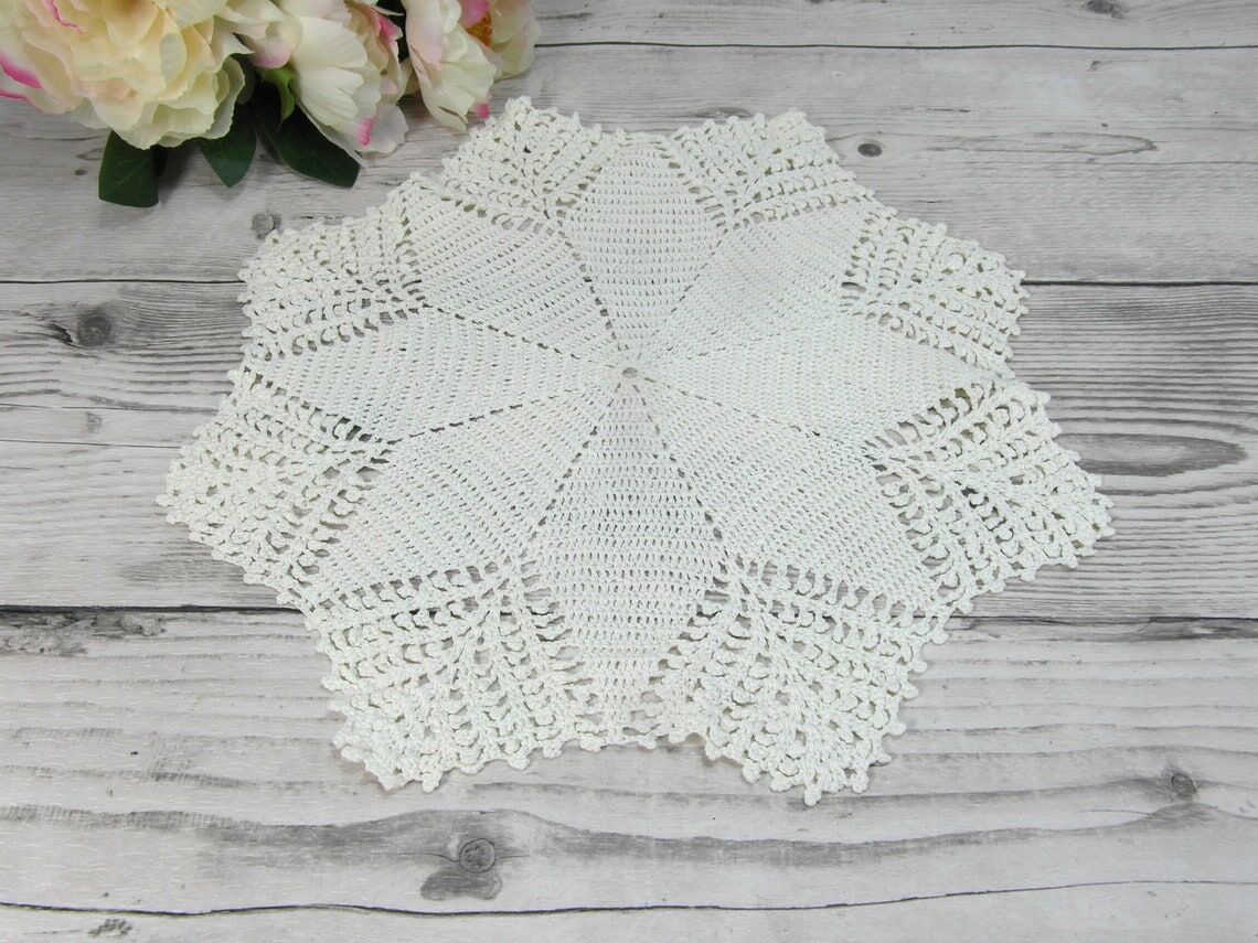 Handmade round placemat in crocheted cotton lace