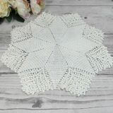 Handmade round placemat in crocheted cotton lace