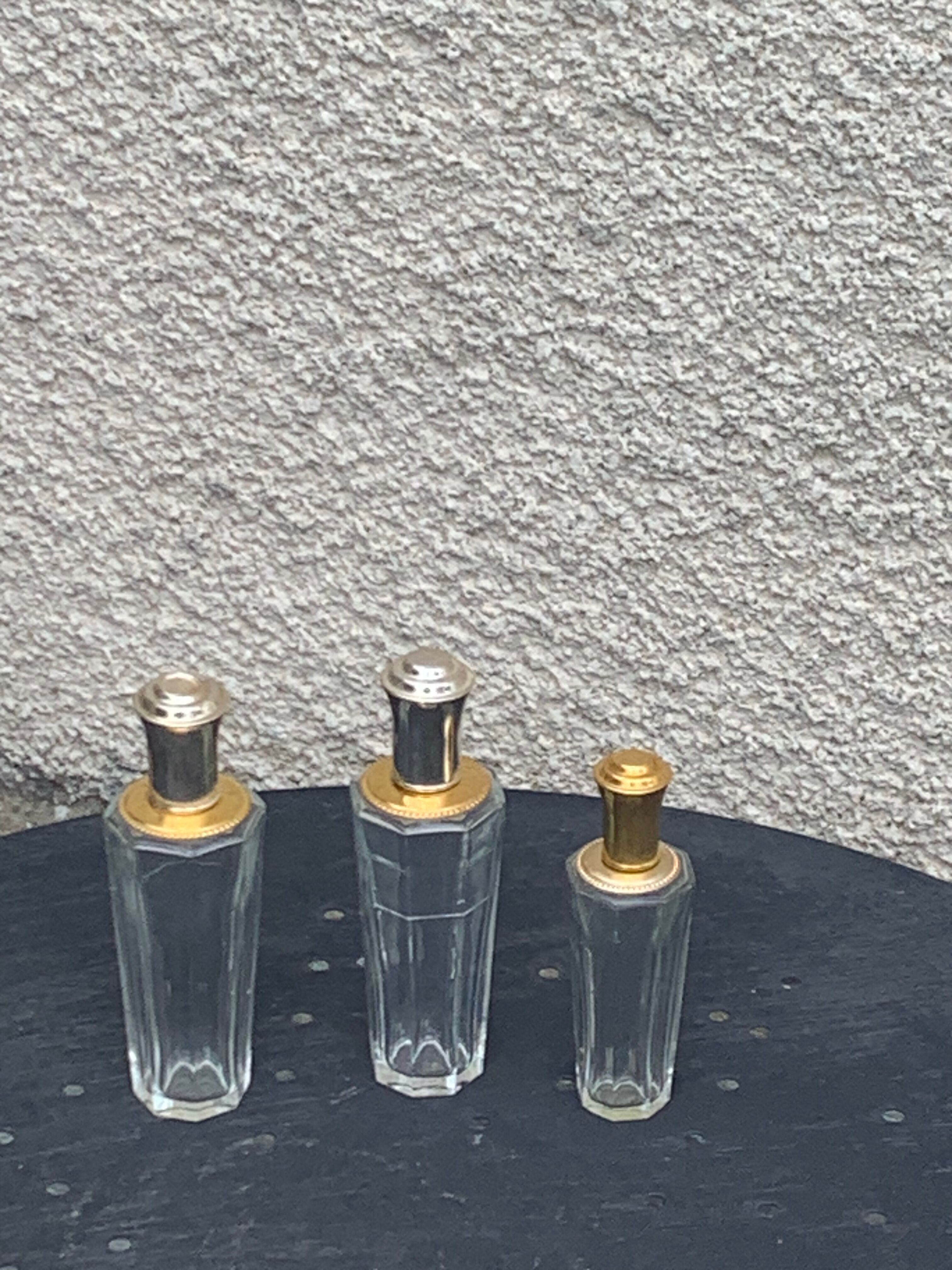 Three bottles of crystal perfume signed Marcel Rochas old france