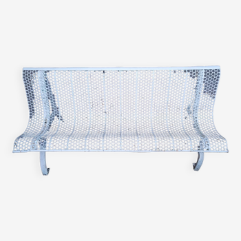 Old perforated outdoor bench