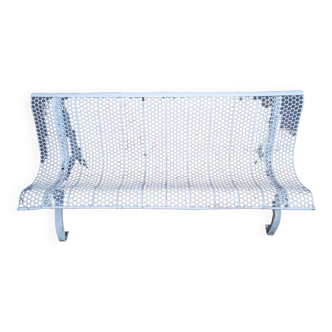 Old perforated outdoor bench