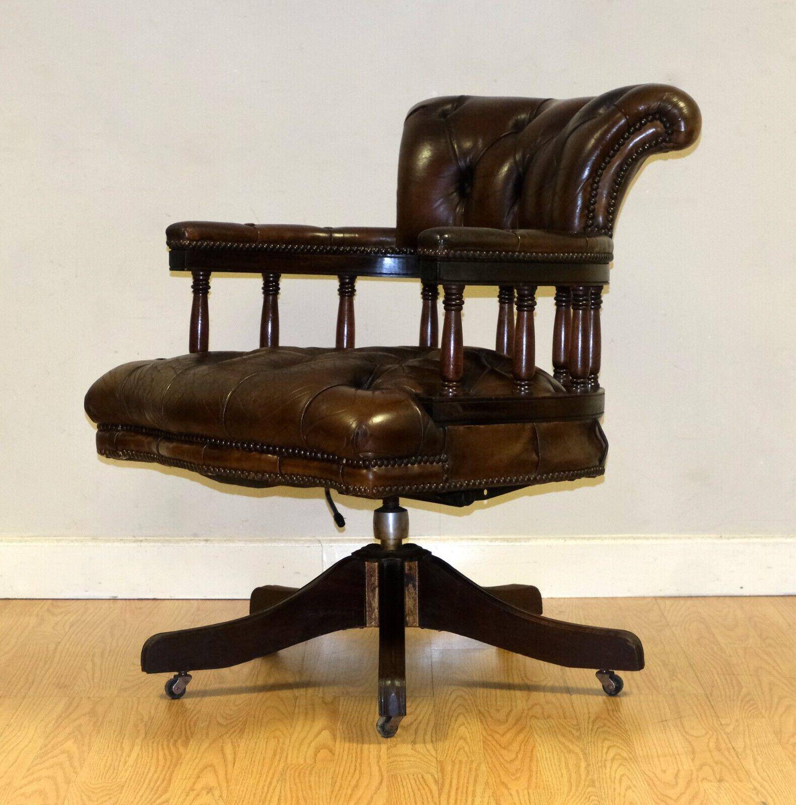 Restored Chesterfield captain's armchair in leather with an oak frame.