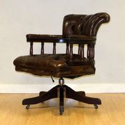 Restored Chesterfield captain's armchair in leather with an oak frame.