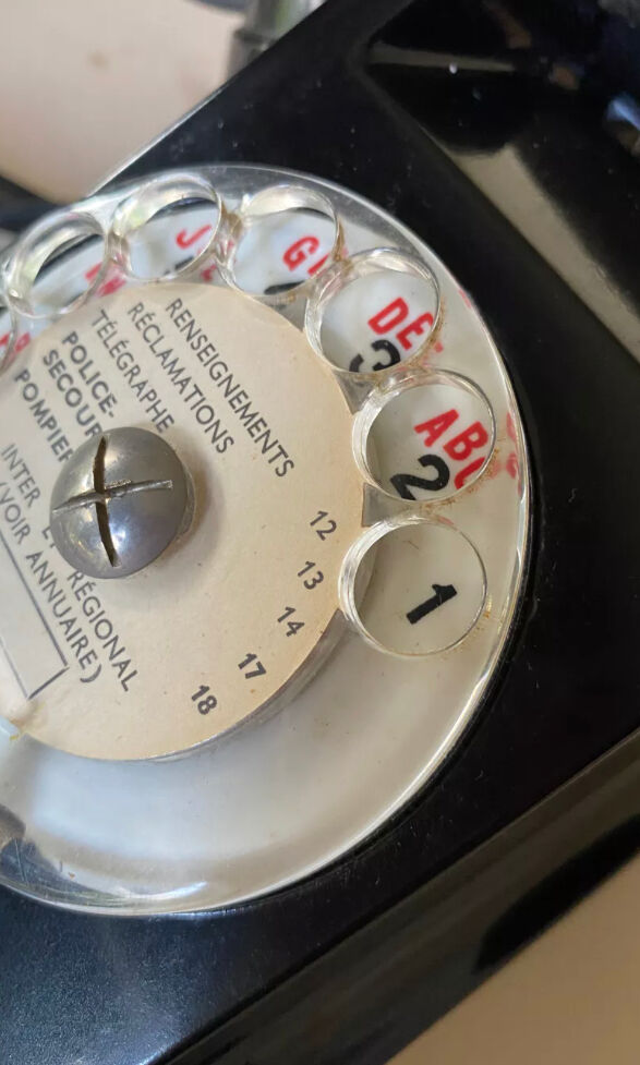 Black Bakelite phone with earphone